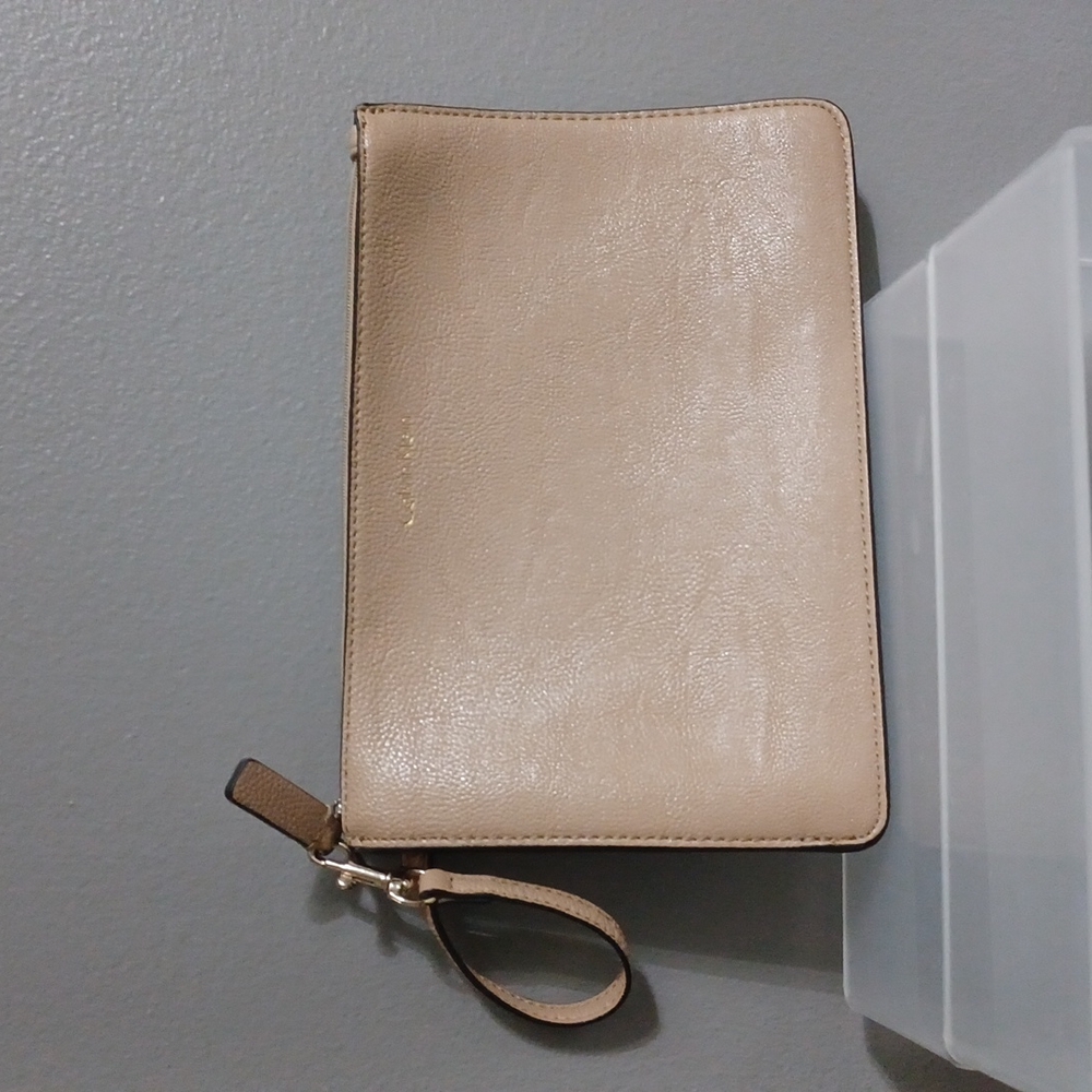 Calvin klein large tan wristlet/Clutch pebbled zipper with white interior